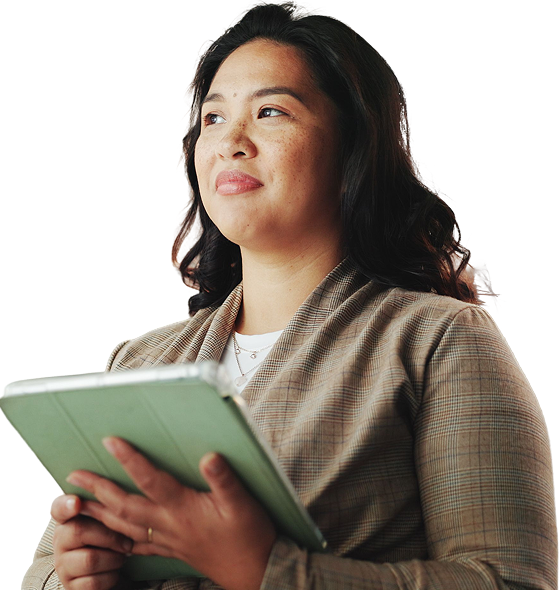 Woman looking up, holding a mobile tablet.